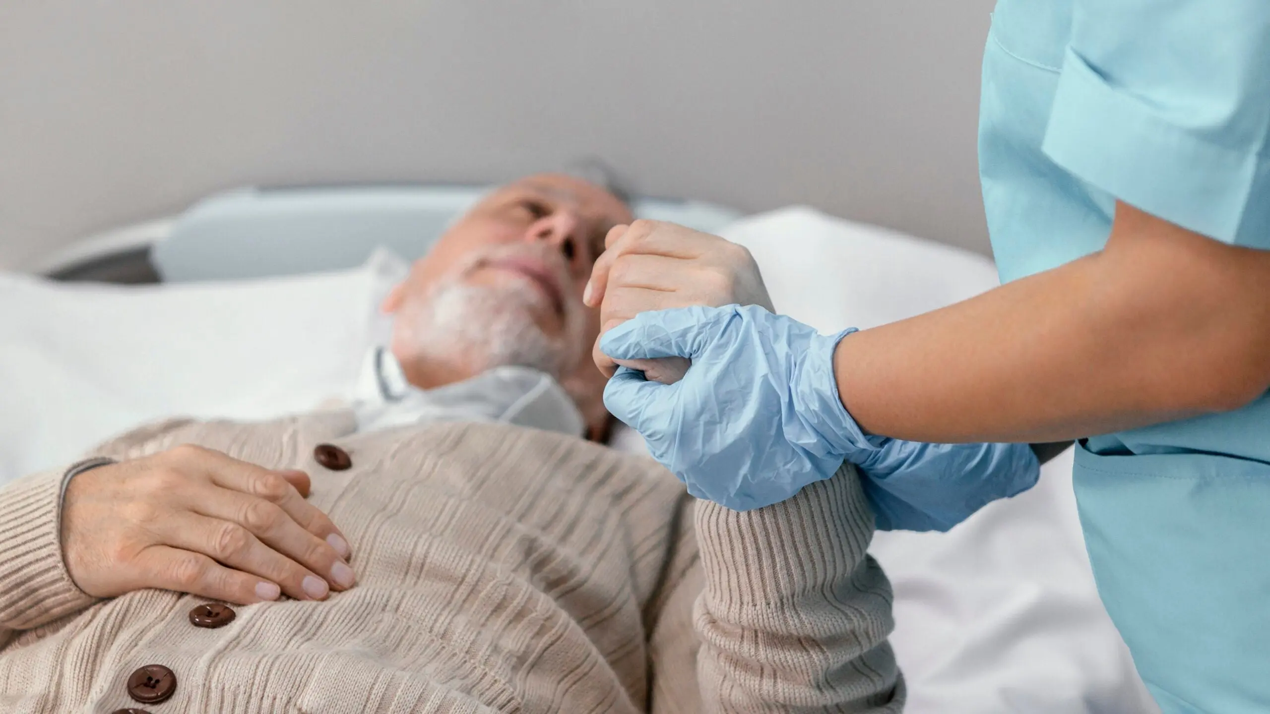 Doctor holding patient's hand