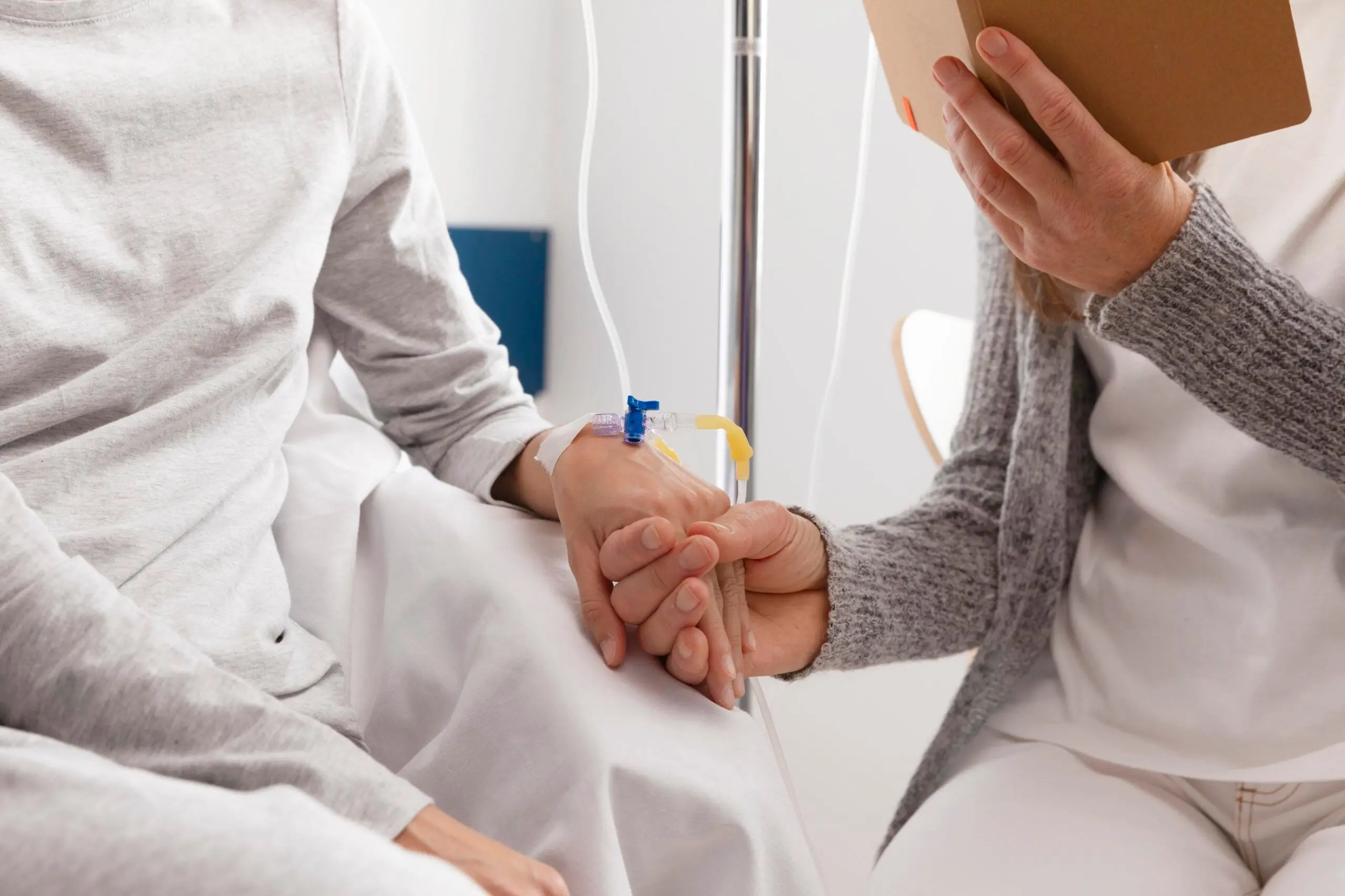 Doctor holding patient's hand
