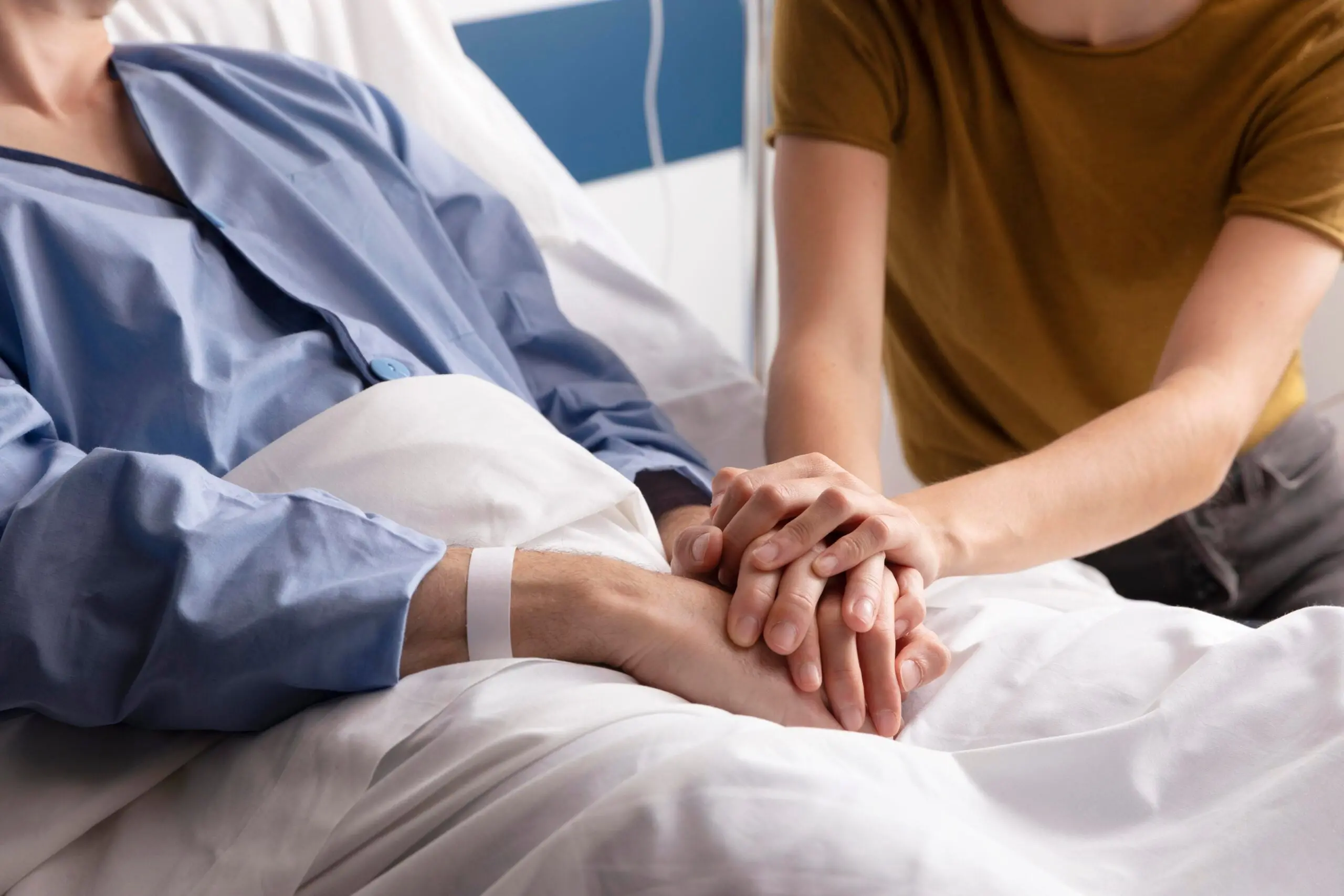 Doctor holding patient's hands