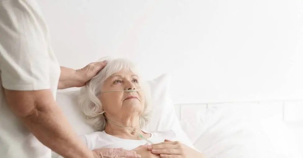 Woman with inserted tube receiving support